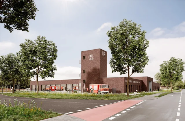 Computergrafik des geplanten Feuerwehrhauses in Winsen (Aller): lang gestrecktes Backsteingebäude mit Fahrzeughalle und Turm mit der Aufschrift 112, davor Straße, Radweg und Bäume, vor dem Gebäude stehen Feuerwehrfahrzeuge